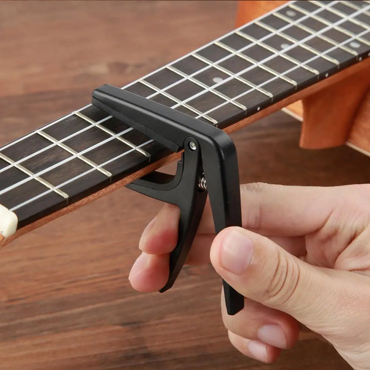 ginee_20260220120108821_3438678163.png TaffSTUDIO Capo Ukulele Simple Design - JPC-02